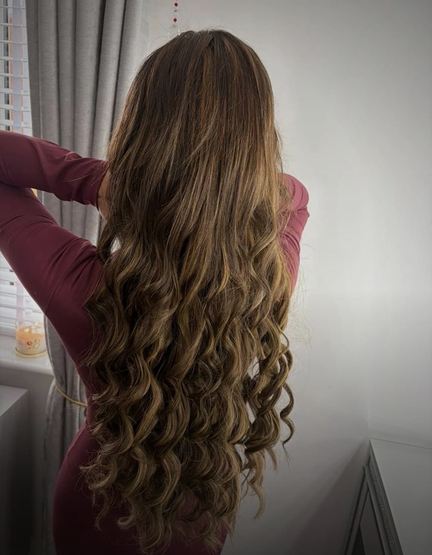 Soft waved brunette hair extension example from the back